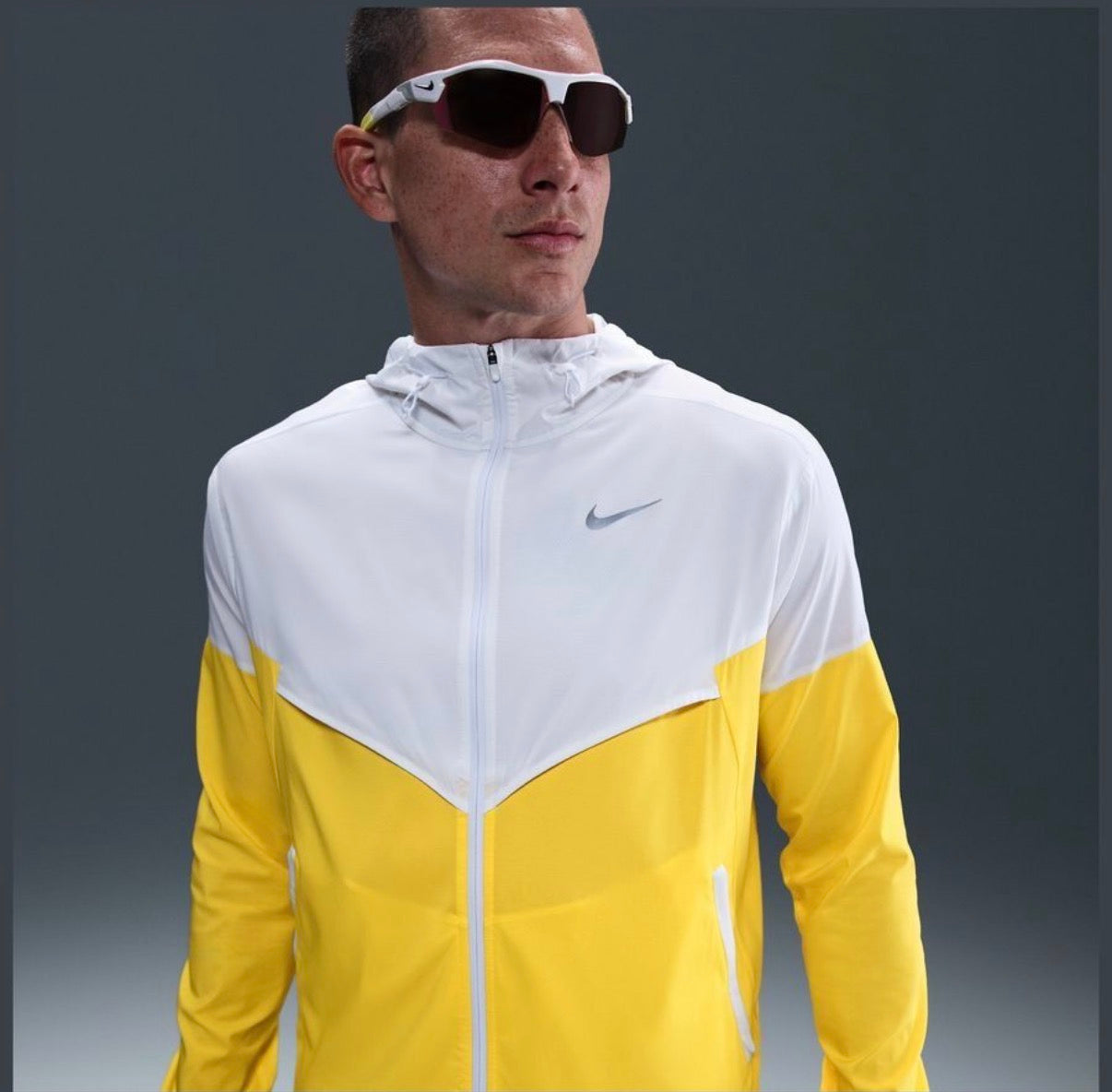 Nike Impossibly Light Windrunner jacket in a white and yellow colorway
