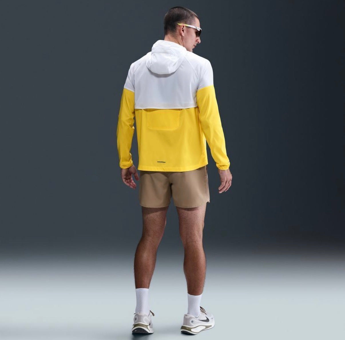 Nike Impossibly Light Windrunner jacket in a white and yellow colorway